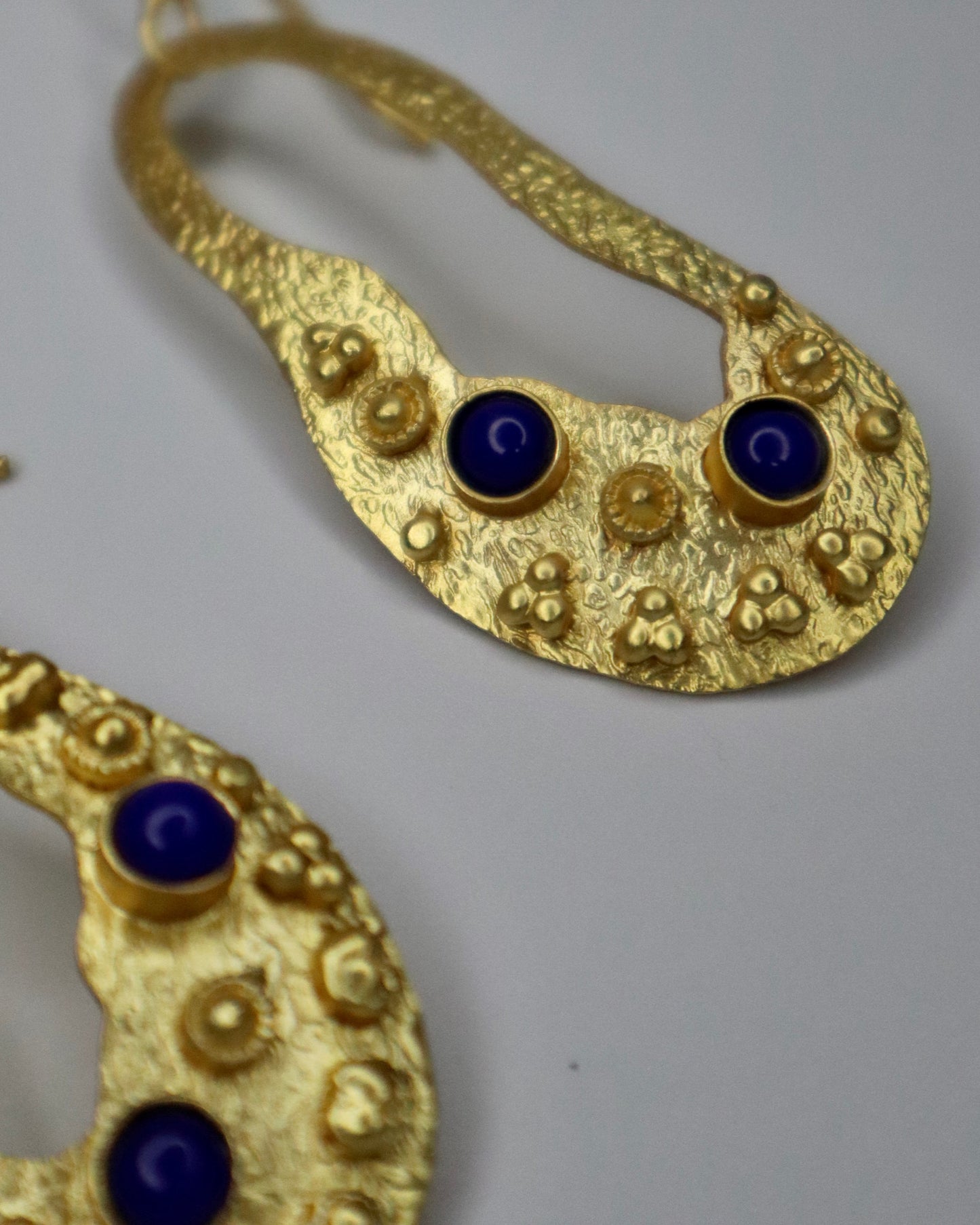 Golden Earrings with blue stone detail